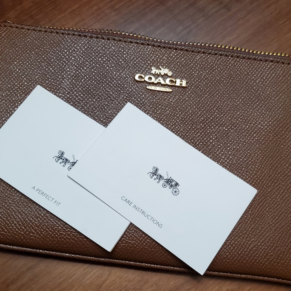 Coach New York.  Brown pebbled leather wristlet